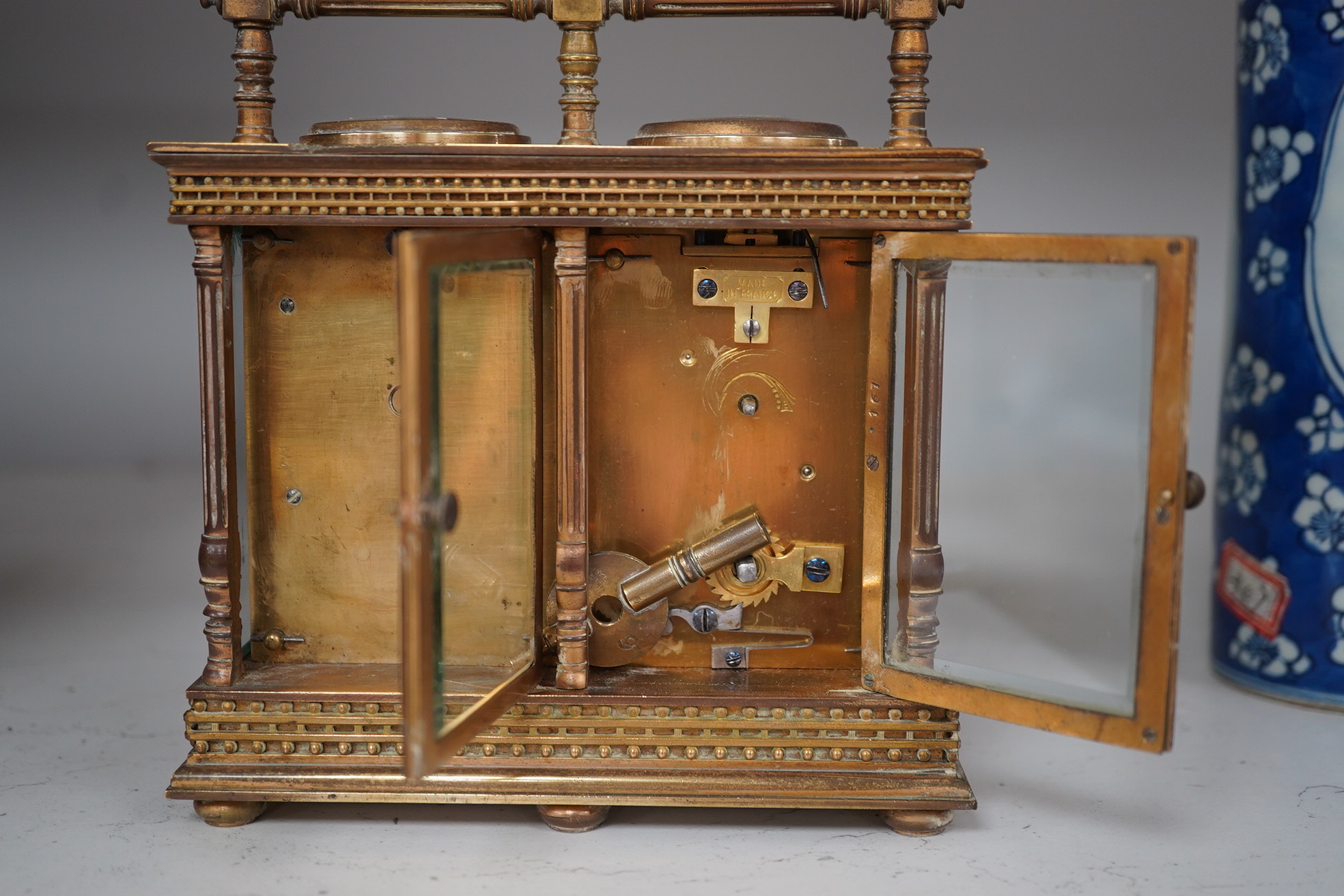 A French eight day carriage timepiece / barometer, retailed by Harrods, 16cm. Condition - fair, not tested
